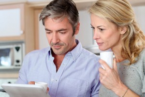 Couple looking at our website on an iPad